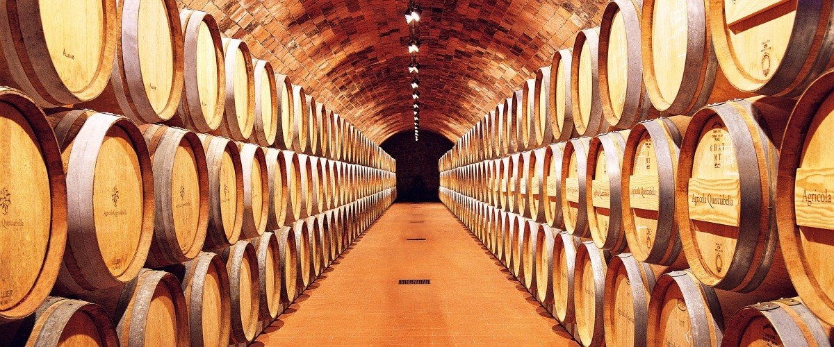 Stacked barrels in Querciabella cellar