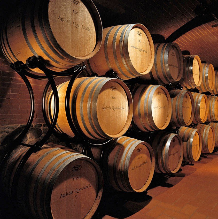 Querciabella barrels stacked in the cellar